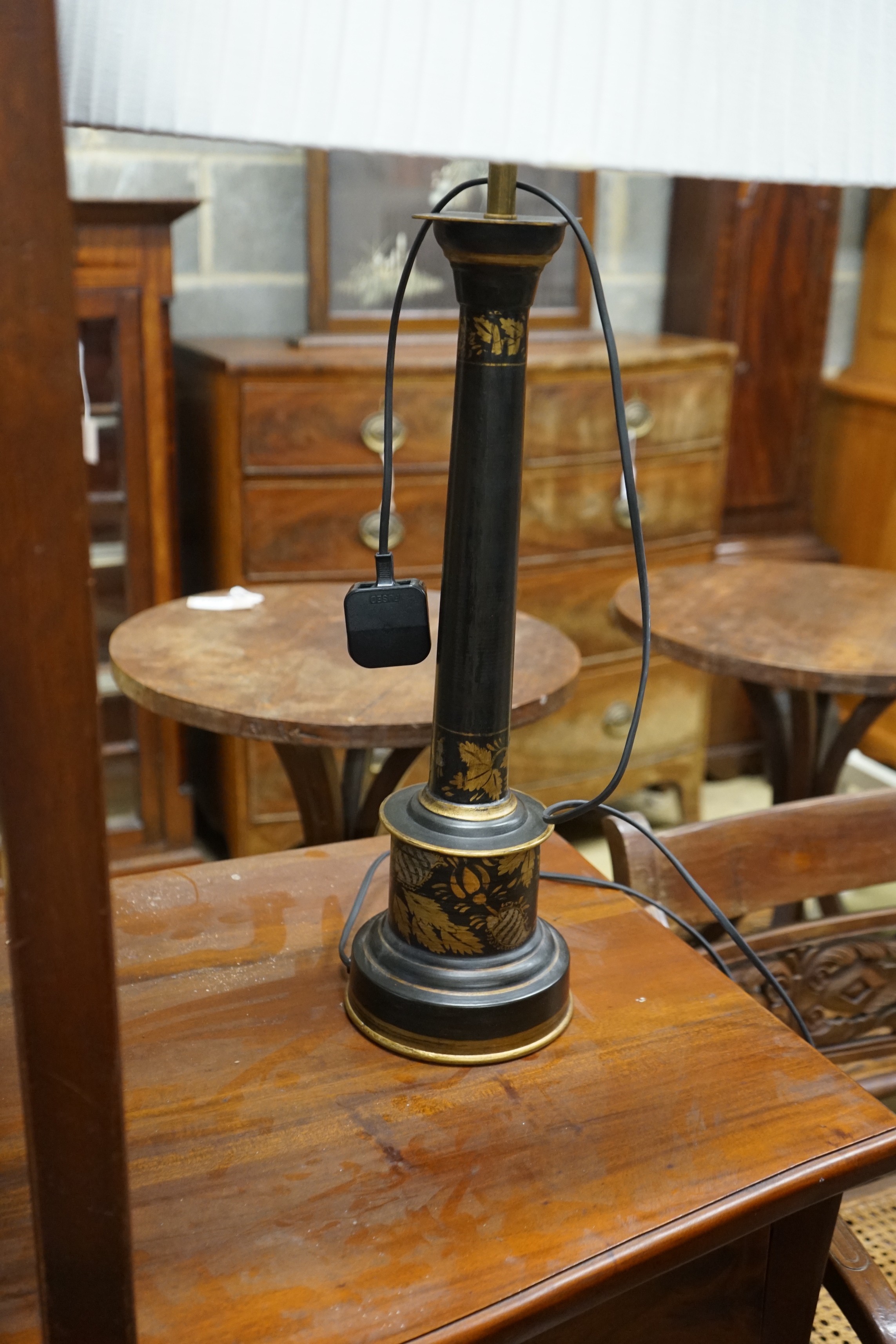 A pair of Oka gilt leaf decorated lacquered table lamps and shades, height including shades 89cm